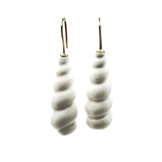 Pair of white spiral-shaped shell earrings with a white background.