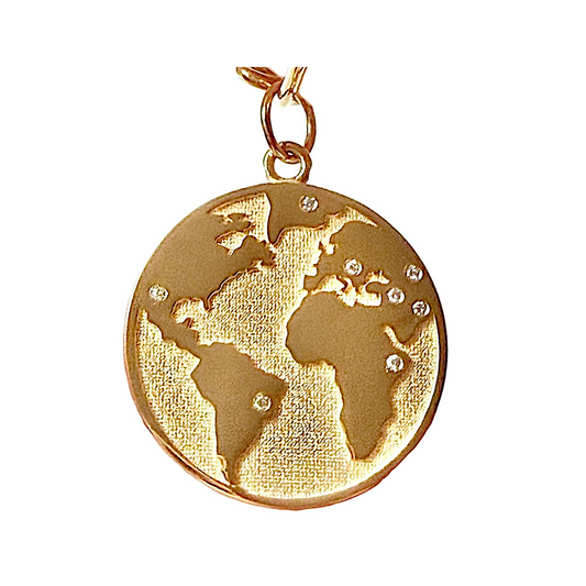 Gold pendant with world map design on a white background