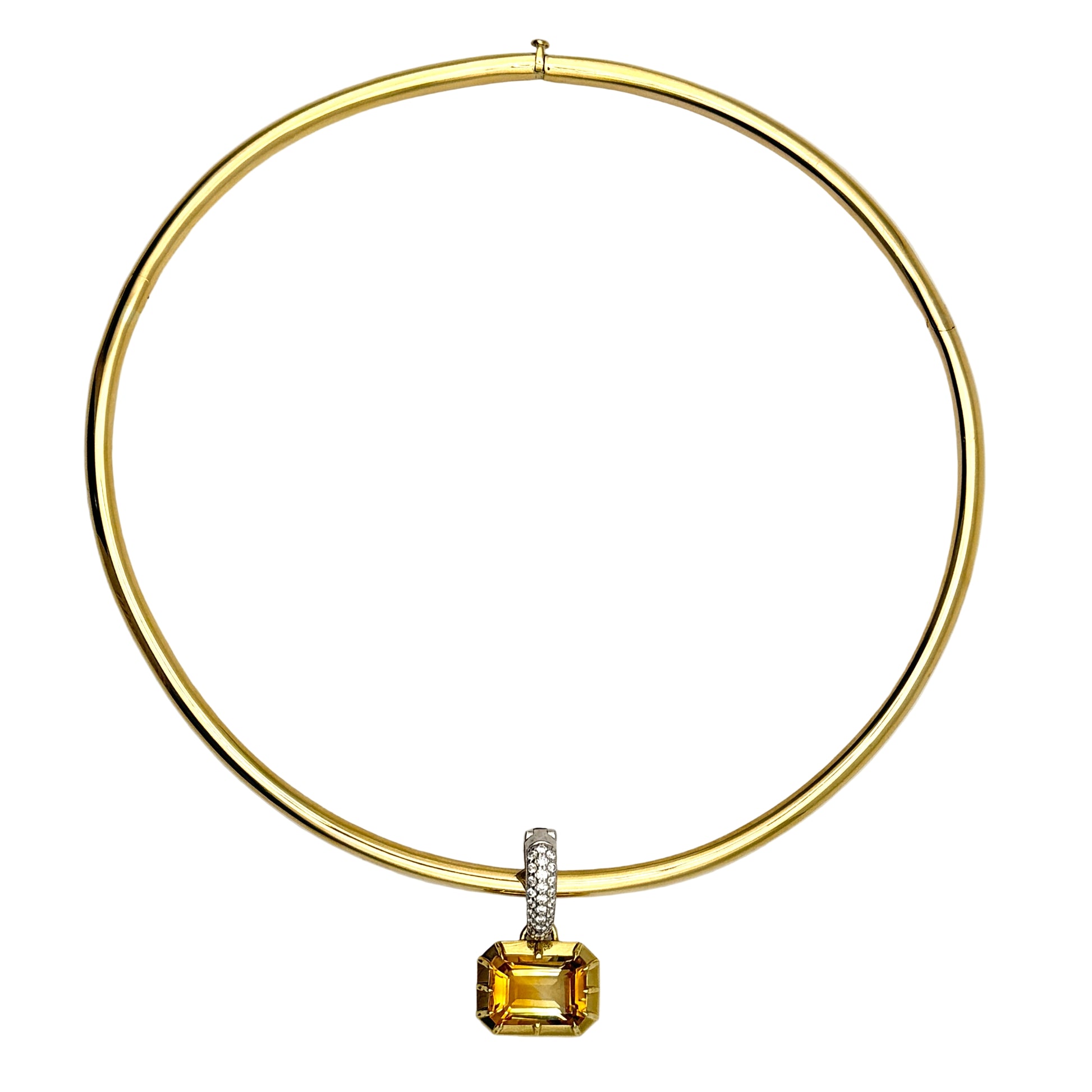 Gold necklace with a yellow gemstone pendant on a white background