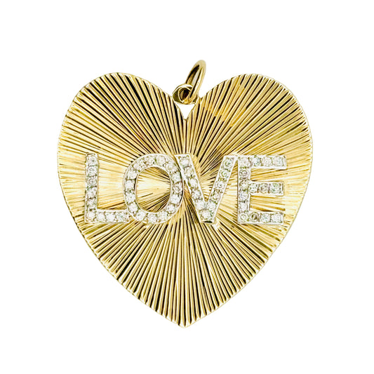 Gold heart-shaped pendant with 'LOVE' engraving on a white background