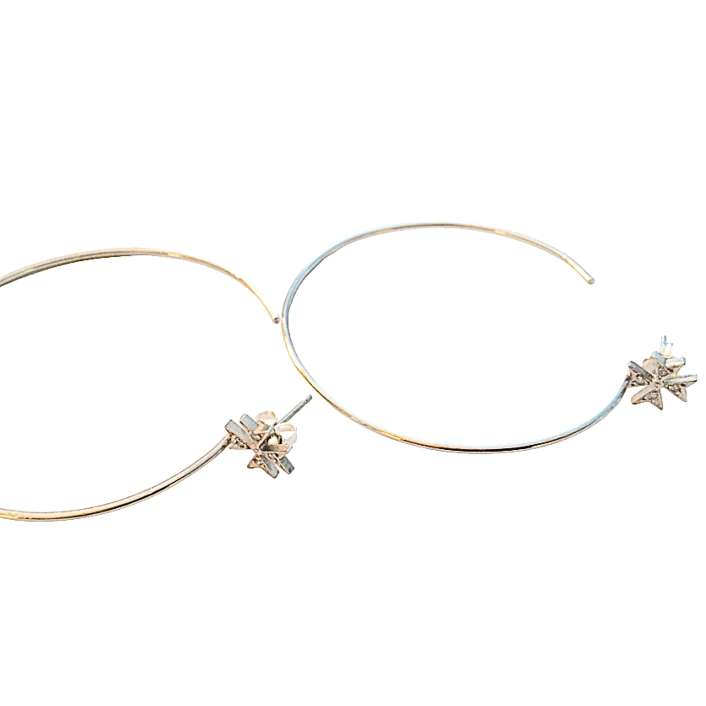 A pair of silver-colored hoop earrings with a Maltese cross design and small star-shaped embellishments.