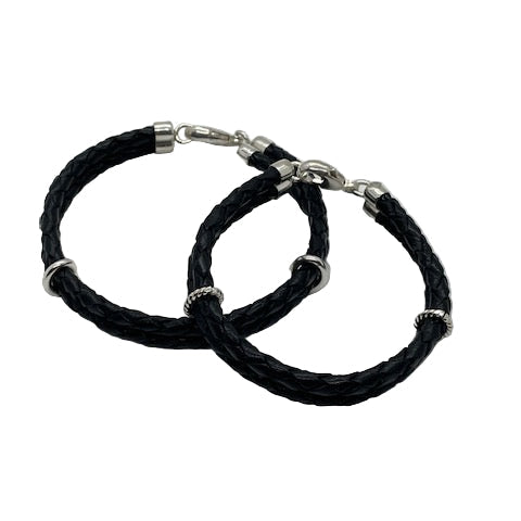 Two men's leather bracelets with silver bands and closures.