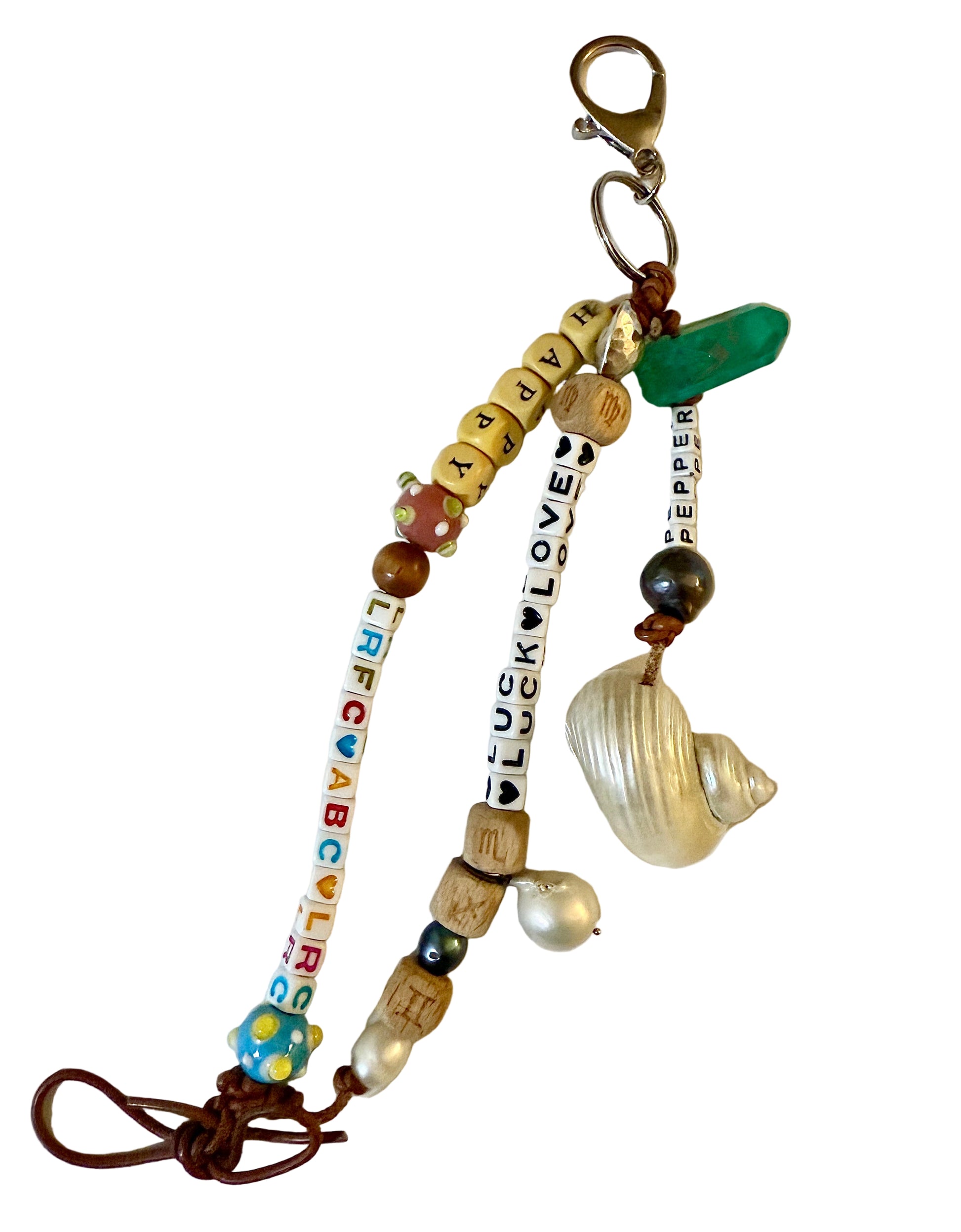 Colorful beaded keychain with various charms on a white background