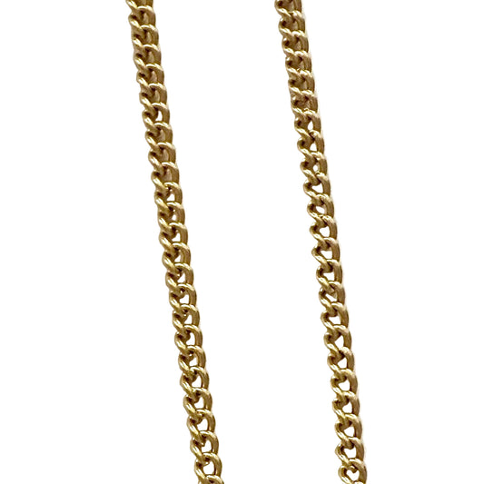 Gold chain necklace on a white background