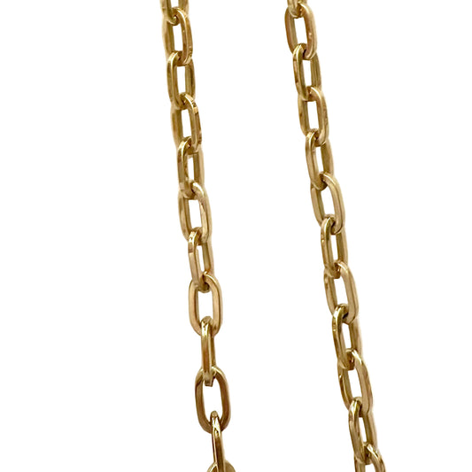 Gold chain necklace on a white background