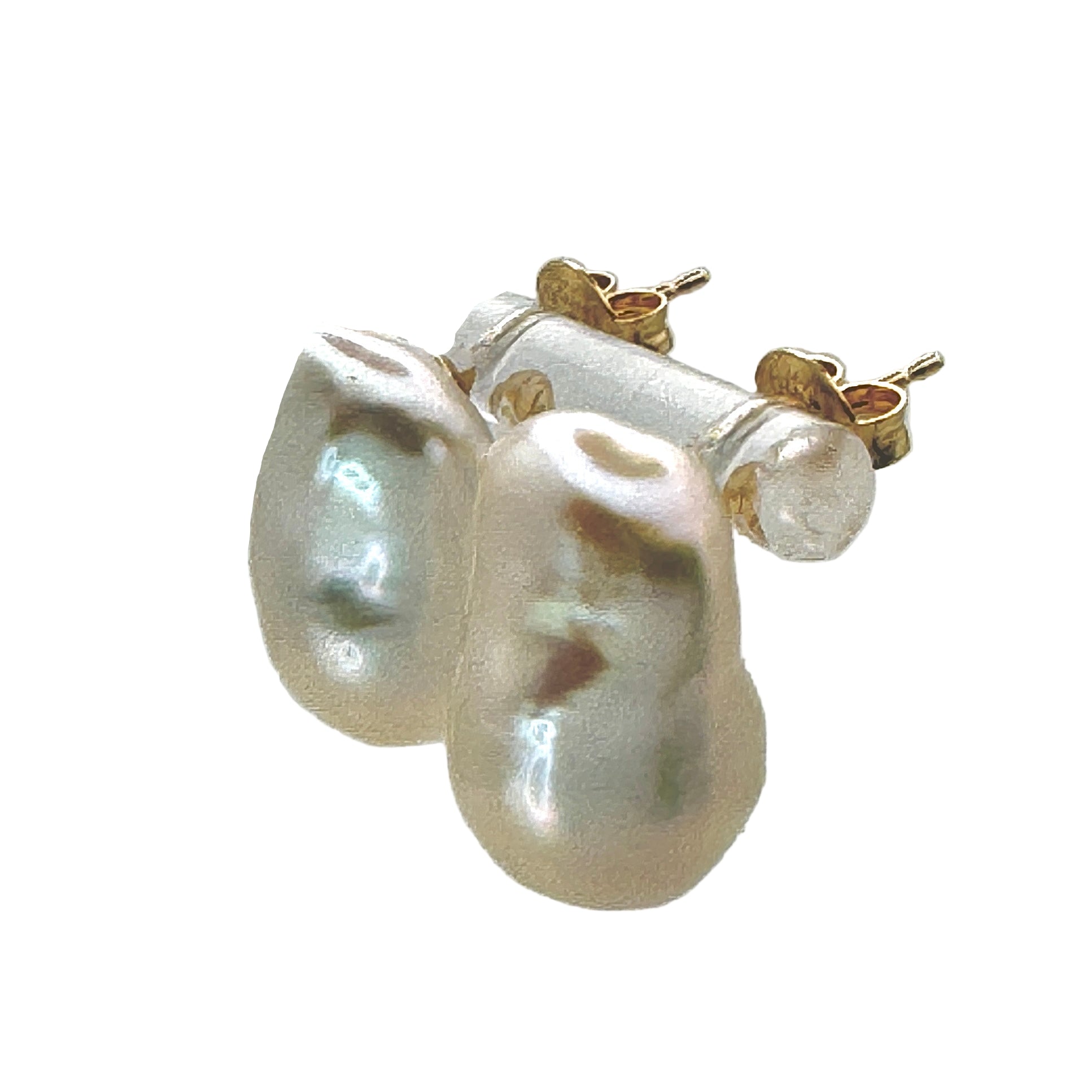 Pearl earrings with gold clasps on a light gray background
