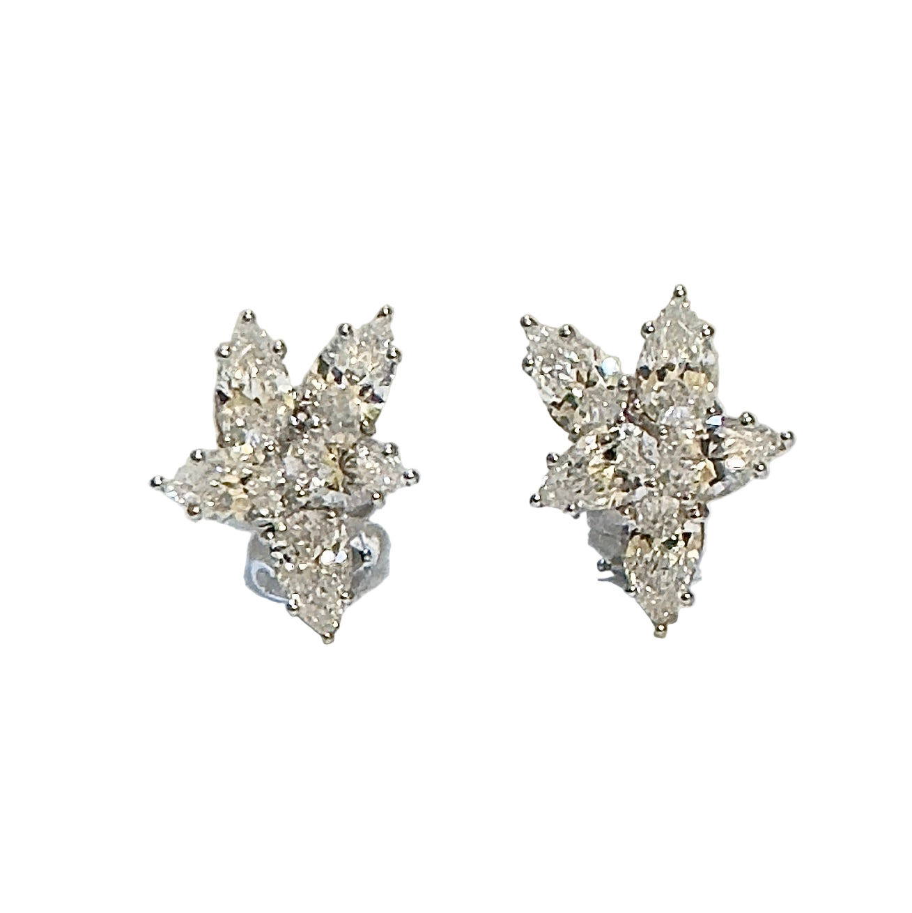 Pair of diamond earrings on a white background