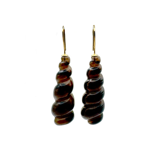 Pair of spiral-shaped brown earrings on a white background.
