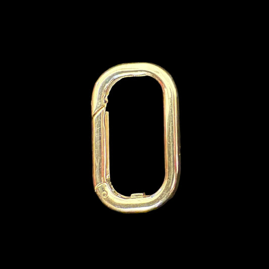 Gold loop carabiner clip on a black background