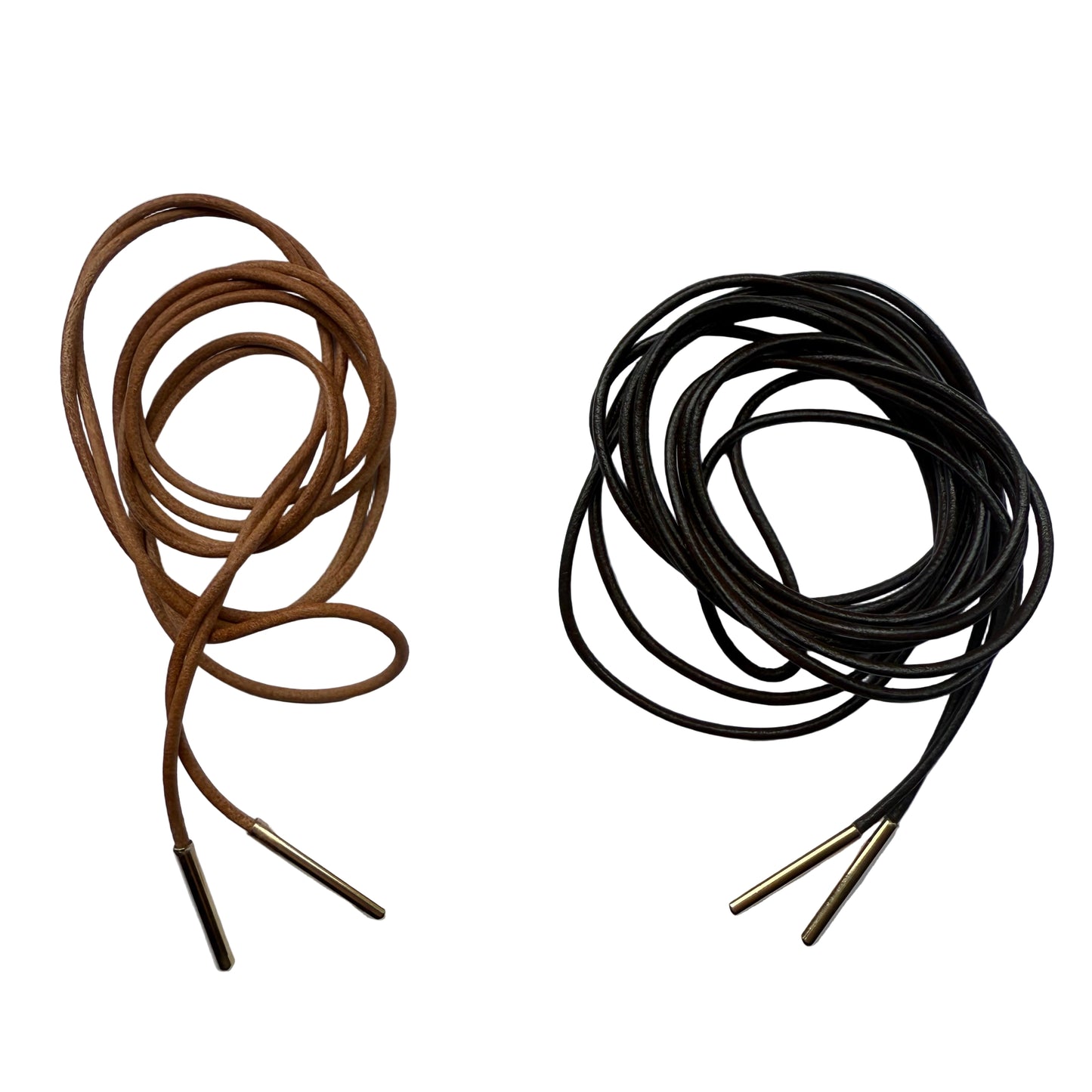 Brown and black shoelace cords with gold metal tips on a white background