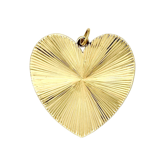 Gold heart-shaped pendant on a white background