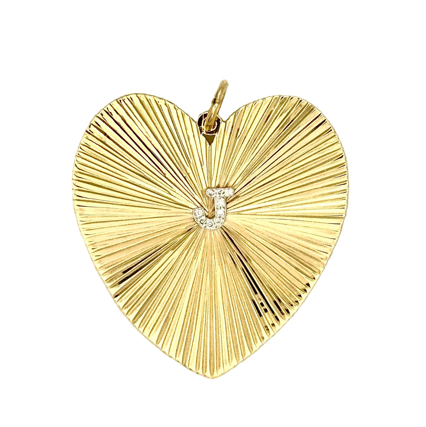 Gold heart-shaped pendant, etched radiating surface, with 'J' in diamonds in the center. 