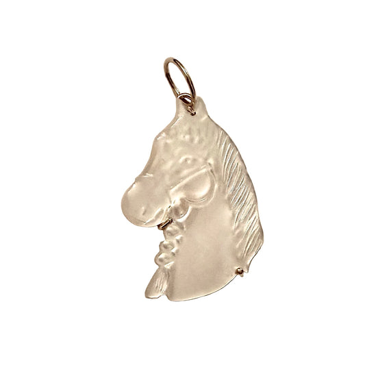 Shell horse head pendant on a white background