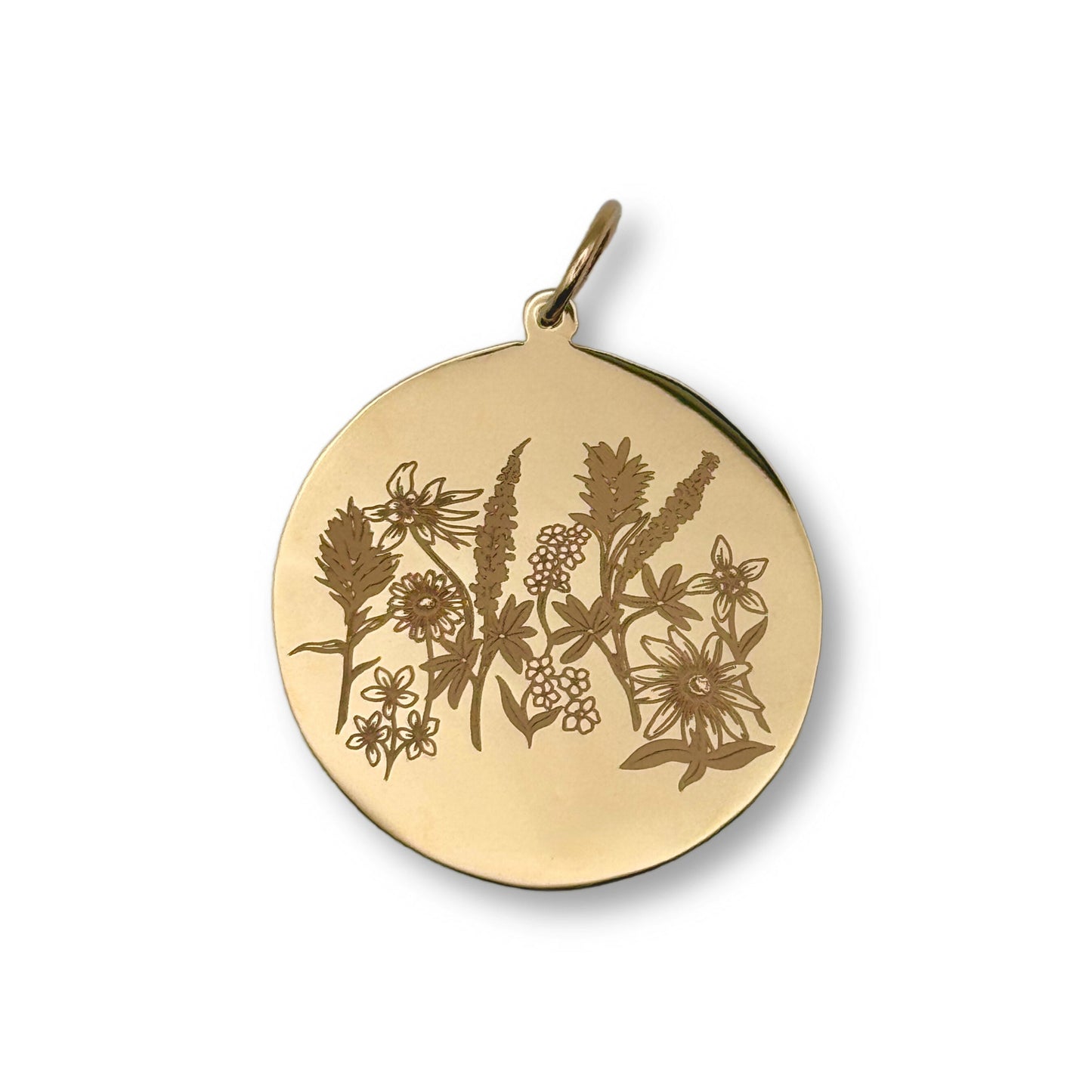 A round gold pendant featuring an engraved floral and botanical design, shown on a clean white background.