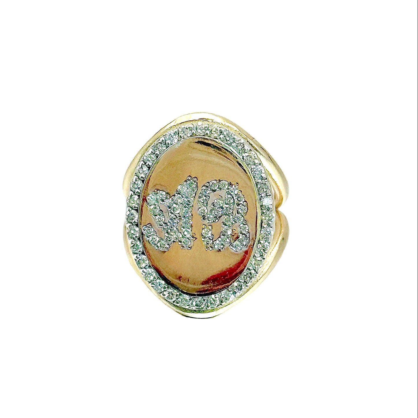 Gold ring with gemstones on a white background