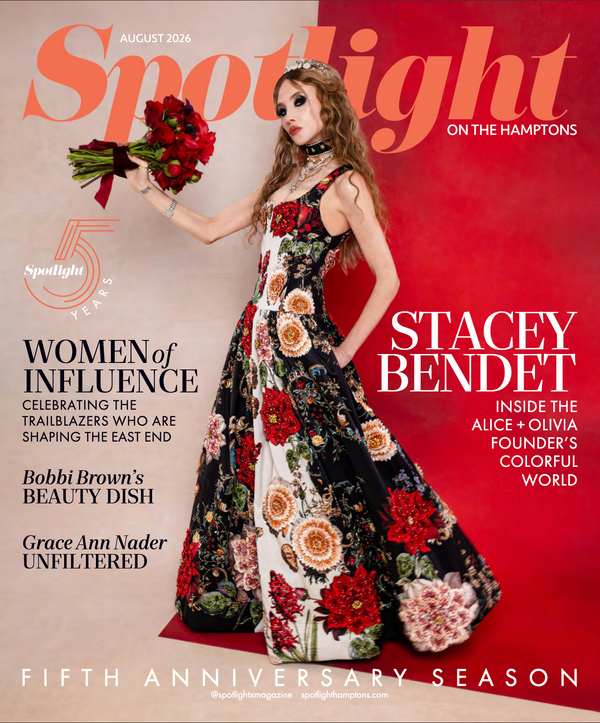 Spotlight magazine cover featuring Stacey Bendet in a sleeveless black dress with large red, orange, and cream floral embroidery, holding a bouquet of red roses against a split beige and red background.