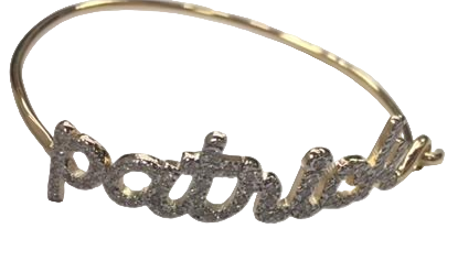 A 14k gold bracelet with pave diamond letters spelling out 'Patrick', with a gold band and pave diamond accents.