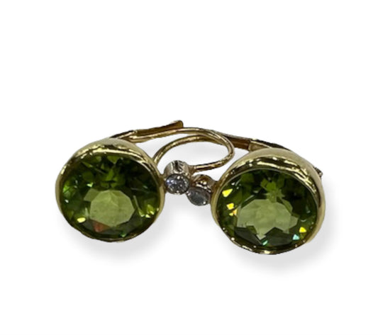 A pair of 18K gold-colored peridot earrings with a screw-back closure.