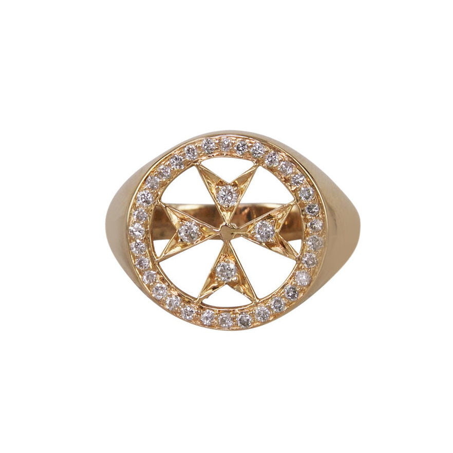 A 14k yellow gold pinky ring with a pave diamond Maltese emblem in the center.